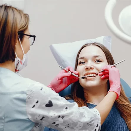 Dentist applying protective liquid dental sealant